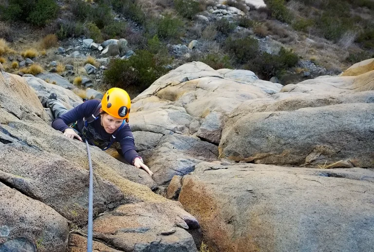 A Cain Leadership client challenges themselves to learn new skills while rock climbing.