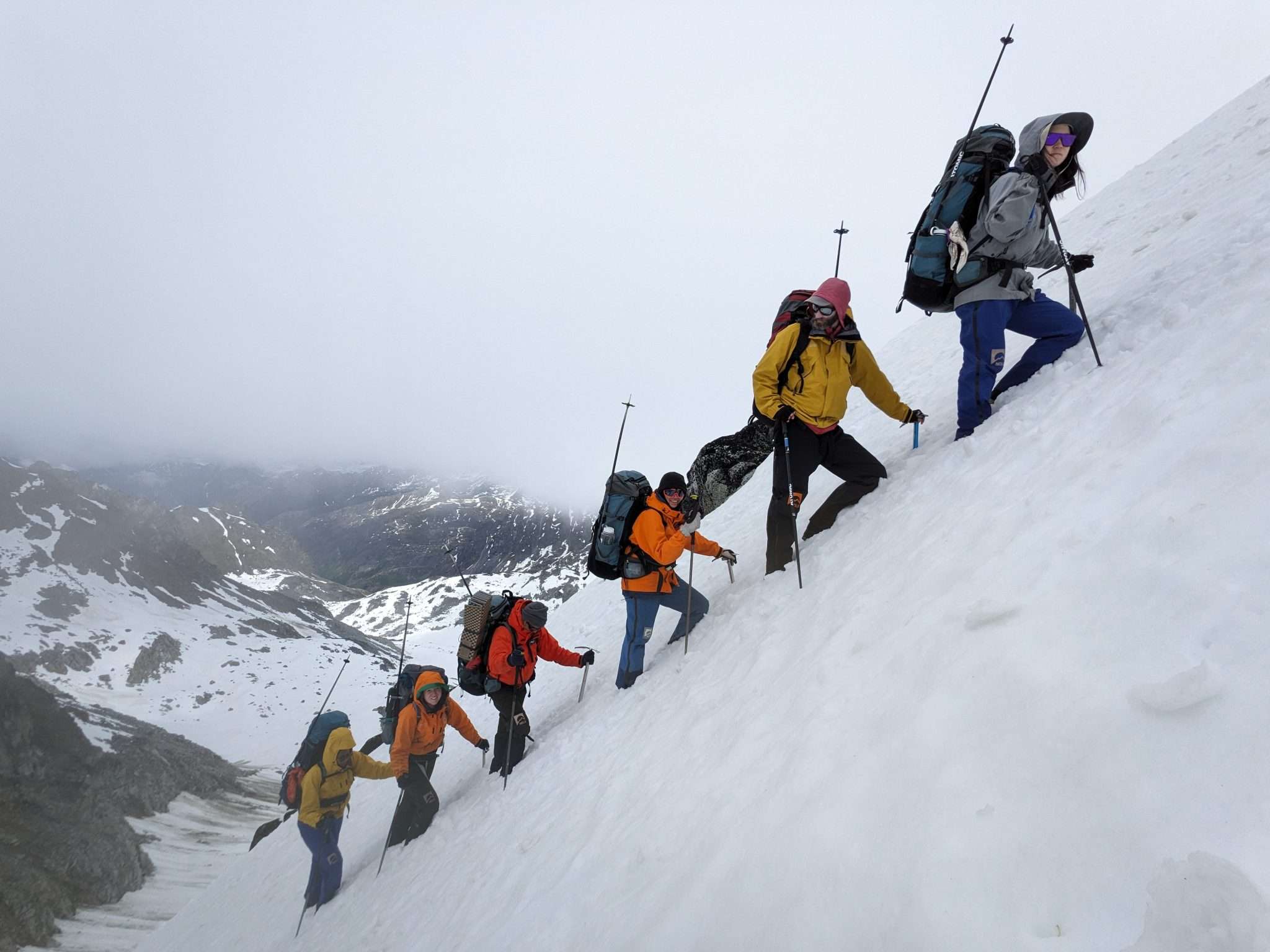 Leadership coaches guiding on a mountain