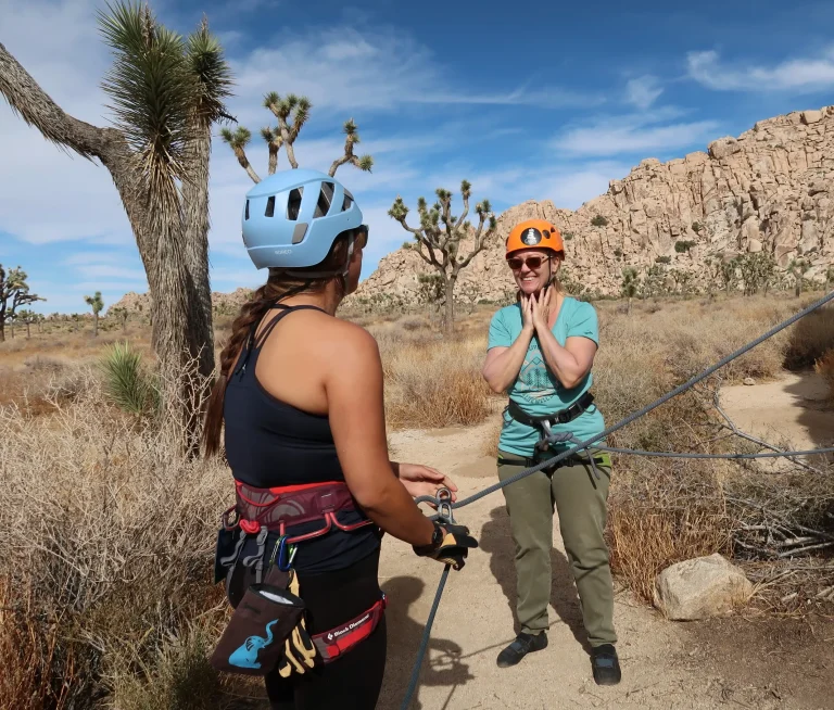 Two women rock climbing at Joshua Tree while talking about how to use empathy