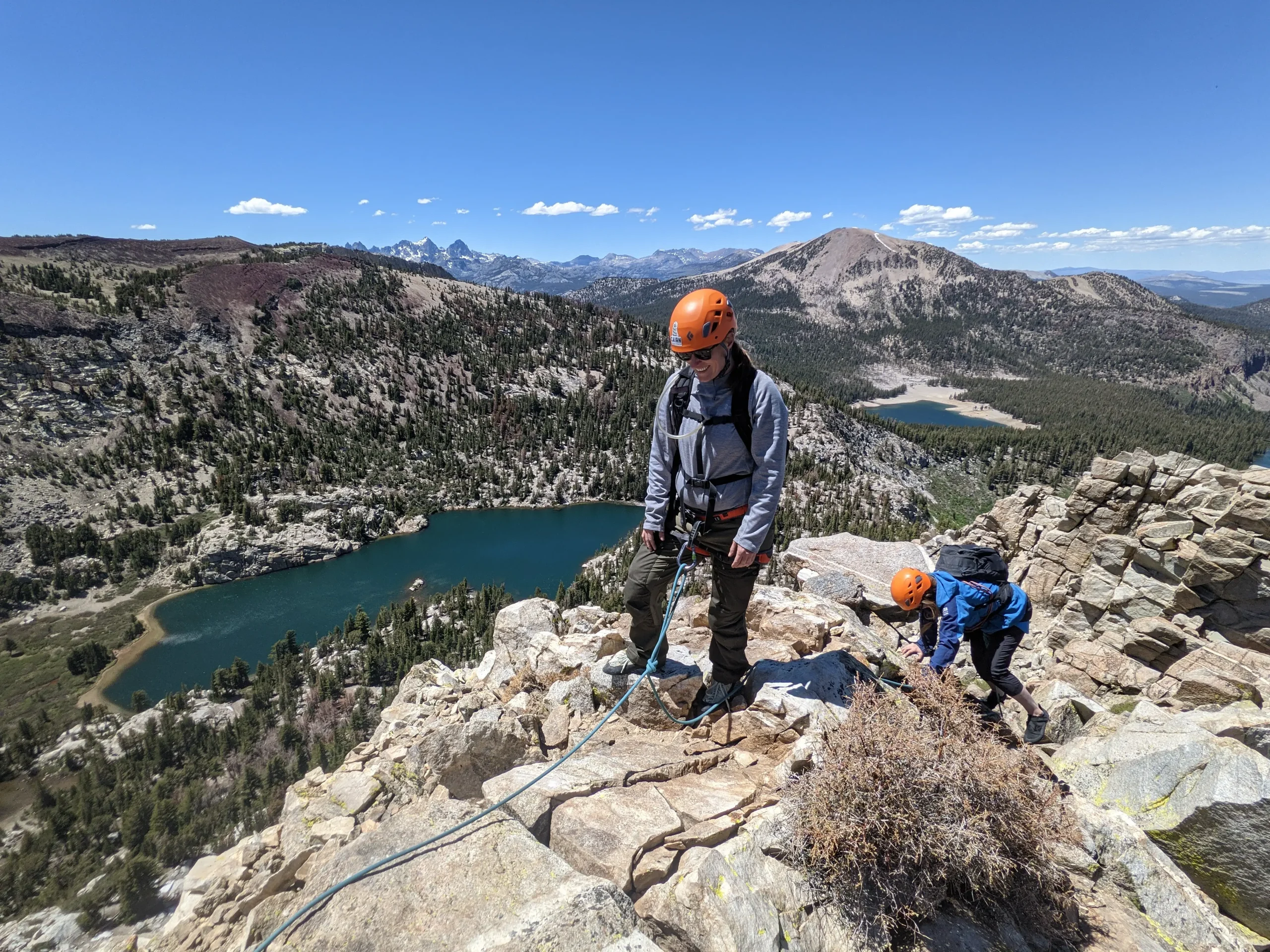A group of climbers are burned out as they reach the summit of a mountain.
